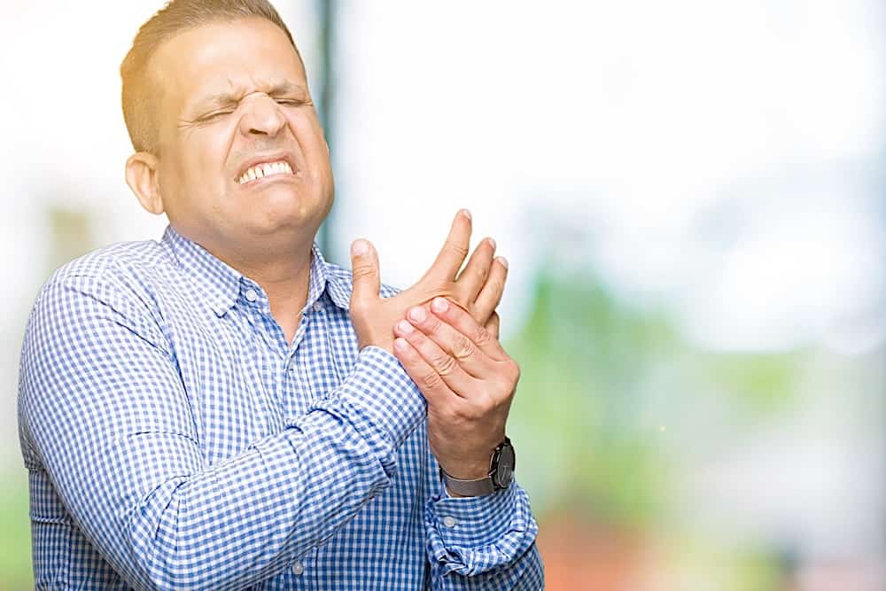 Middle Age Arab Business Man Over Isolated Background Suffering Pain On Hands And Fingers, Arthritis Inflammation