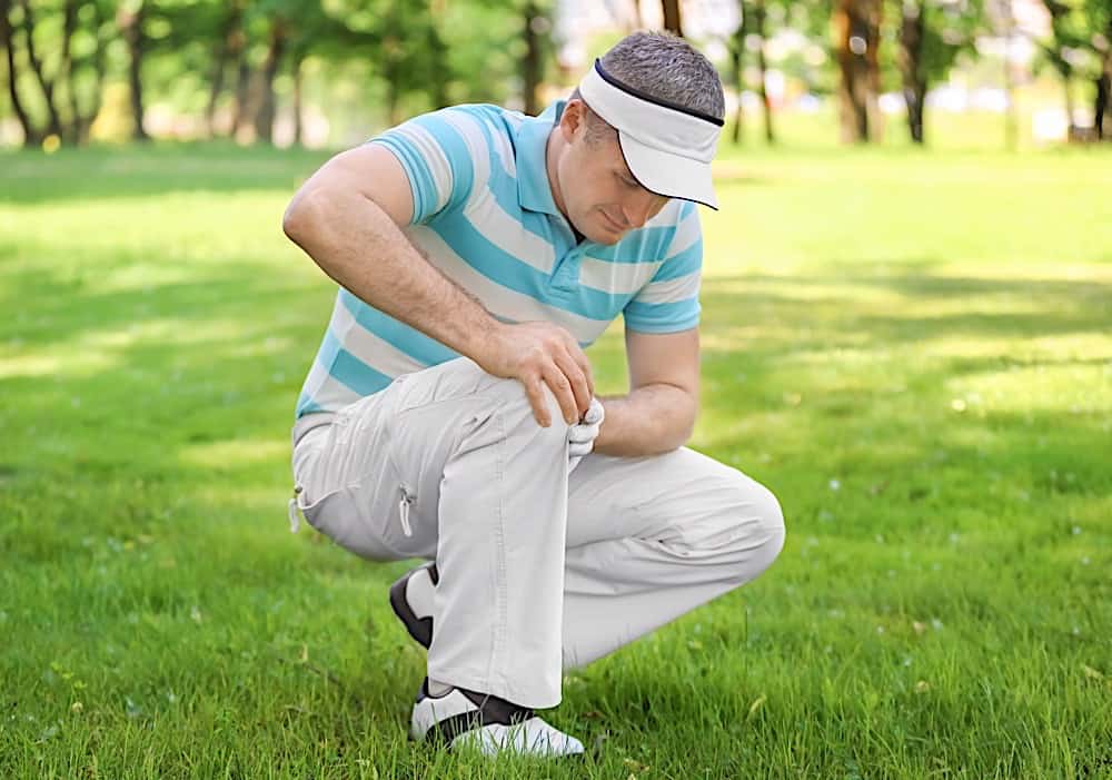 Young Man On Golf Course In Sunny Day